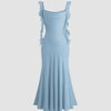 Light blue midi dress with ruffled straps, scoop neckline, and a fishtail hem for elegant movement and playful charm