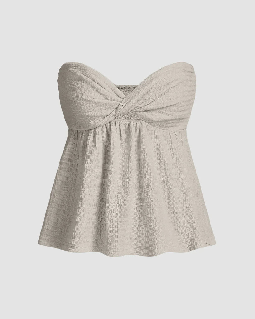 Light grey twist front top with empire bustier top with a flared silhouette and sweetheart neckline in soft textured fabric