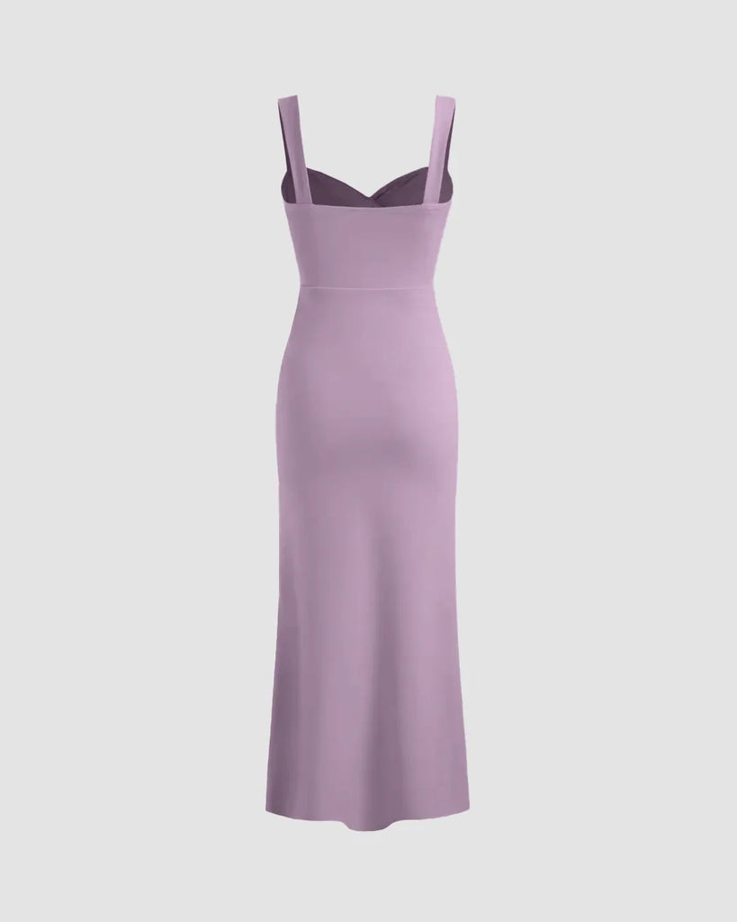 Back view of a Lilac V-neck midi dress featuring a ruched bodice, fitted waist, and subtle fishtail hem for a flattering silhouette.