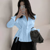 Front view of sky blue plain shirt with long sleeves, waist tie detail and fitted silhouette for a clean look.