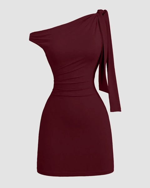 Front view of Maroon mini party dress with asymmetrical neckline and bodycon fit, featuring a sleek silhouette