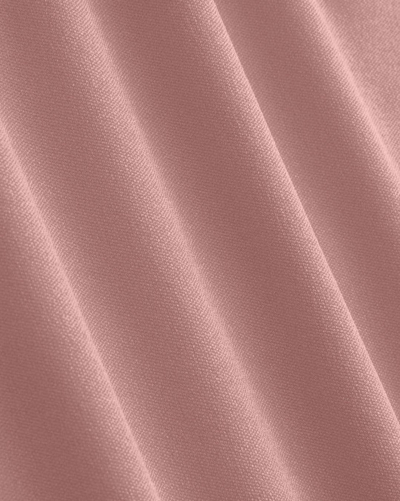 Material view of Solid pink slip dress with a soft, stretchy material, featuring a bustier cami design for a comfortable fit