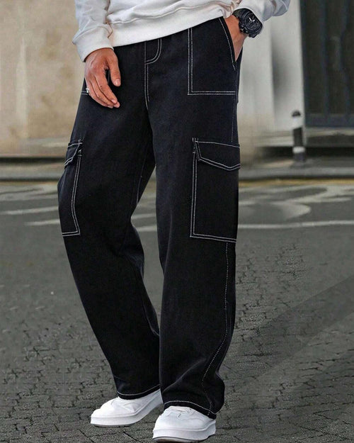 Front view of Black baggy cargo jeans for men with contrast stitching, multiple pockets, wide legs, and Y2K streetwear style.