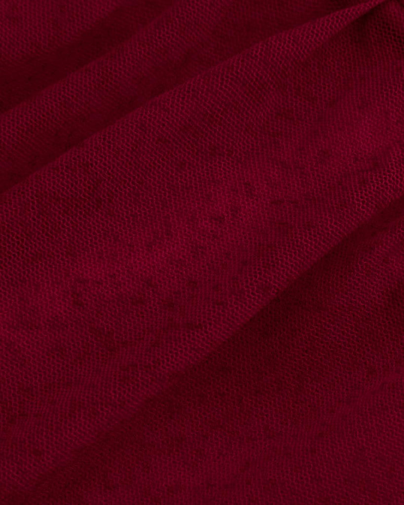 mesh cowl neck mini dress in red, featuring ruched detailing and cascading ruffle close up view