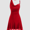 Front view of Red halter-neck mini dress with draped scarf strap, fitted bodice, pleated skirt, and sheer hem, shown front and side.