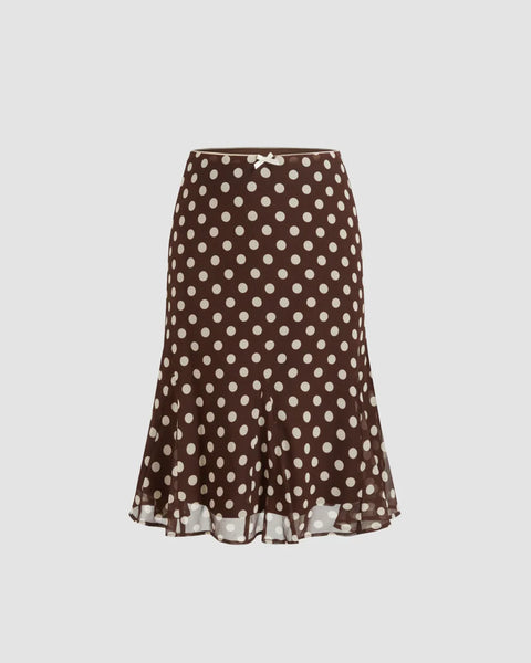Front view of Mesh low-rise polka dot mermaid skirt with a bowknot detail, fitted silhouette, and flared hem for a feminine look.