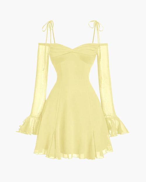 Fit & flare dress in French Vanilla with cold-shoulder mesh sleeves, ruffle cuffs, and delicate tie straps for a romantic look.