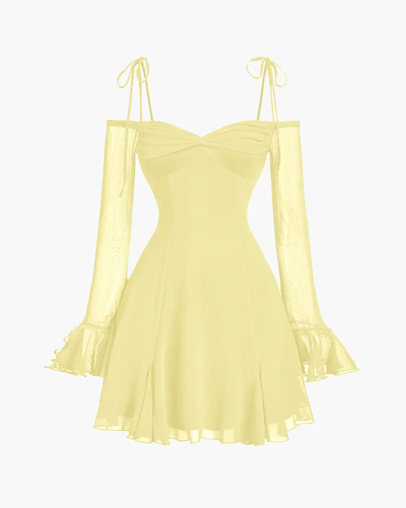 Fit & flare dress in French Vanilla with cold-shoulder mesh sleeves, ruffle cuffs, and delicate tie straps for a romantic look.