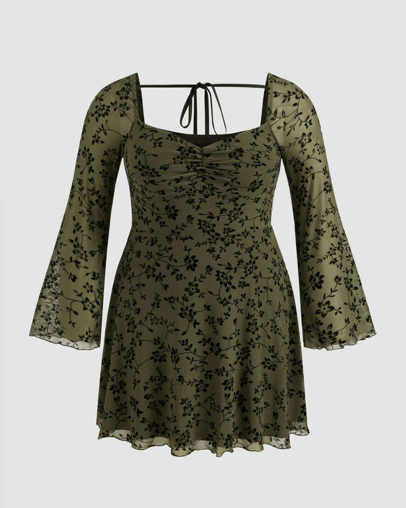 Plus size floral lace mini dress featuring a mesh sweetheart neckline and knotted detail, perfect for stylish curves.