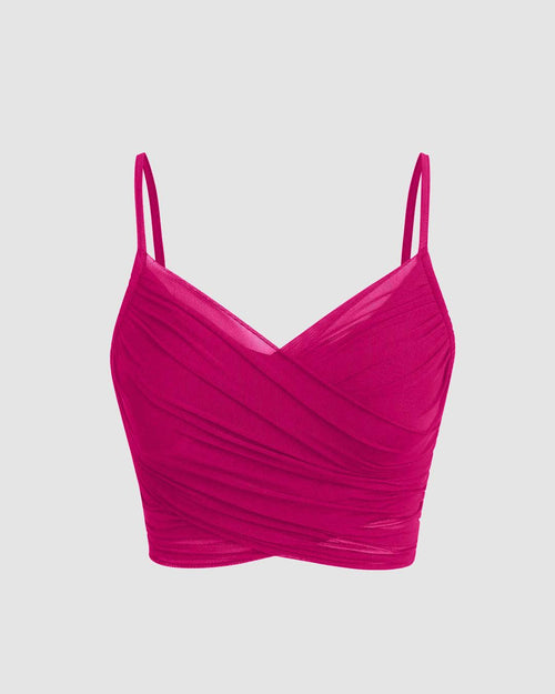 Front view of hot pink women's crop top featuring a mesh V-neck and crisscrossed straps