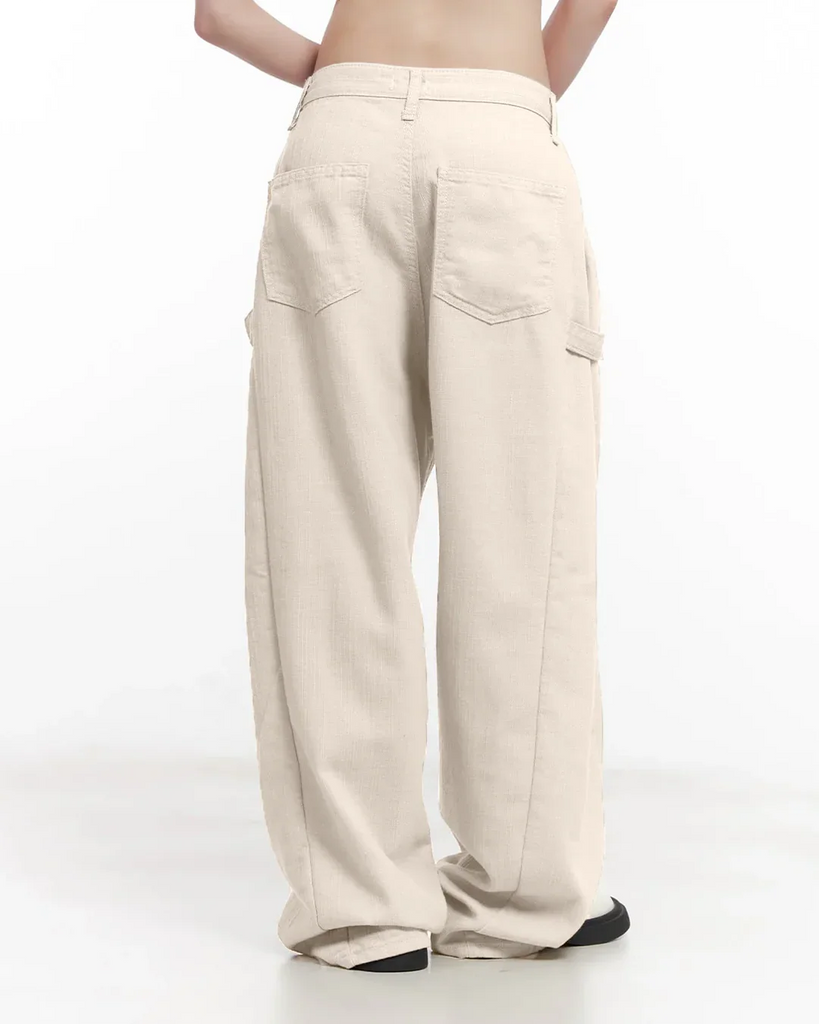 a grey crop top and mid-rise cargo wide-leg trousers