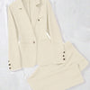 Women's suit featuring a stylish off-white blazer paired with matching pants