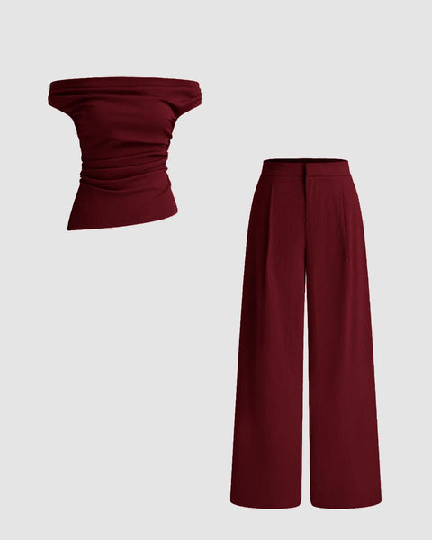 Front view of A Top and Trouser set with maroon off-shoulder ruched top paired with mid-rise straight leg trousers, showcasing a stylish outfit combination.