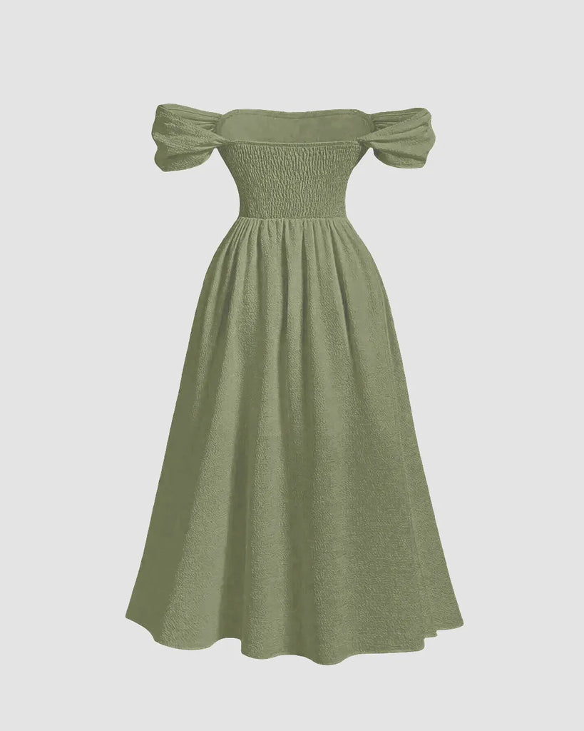 Back view of an off-shoulder midi dress in herbal green featuring ruffled detailing and voluminous puffed sleeves for a romantic, statement-making look.