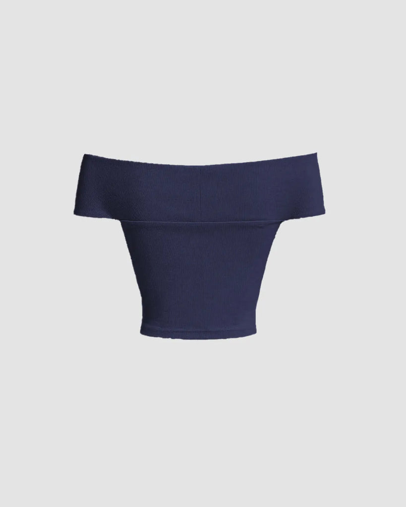 Back view of navy blue off-shoulder crop top with soft ribbed knit fabric for a sleek, fitted look.