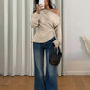 Women wearing Beige off-shoulder solid top with asymmetrical neckline, fitted waist design and long sleeves