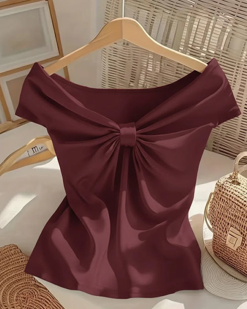 Front view of Maroon off-shoulder short sleeve top with a sweetheart neckline and bow detail, designed in a fitted style for a chic feminine look