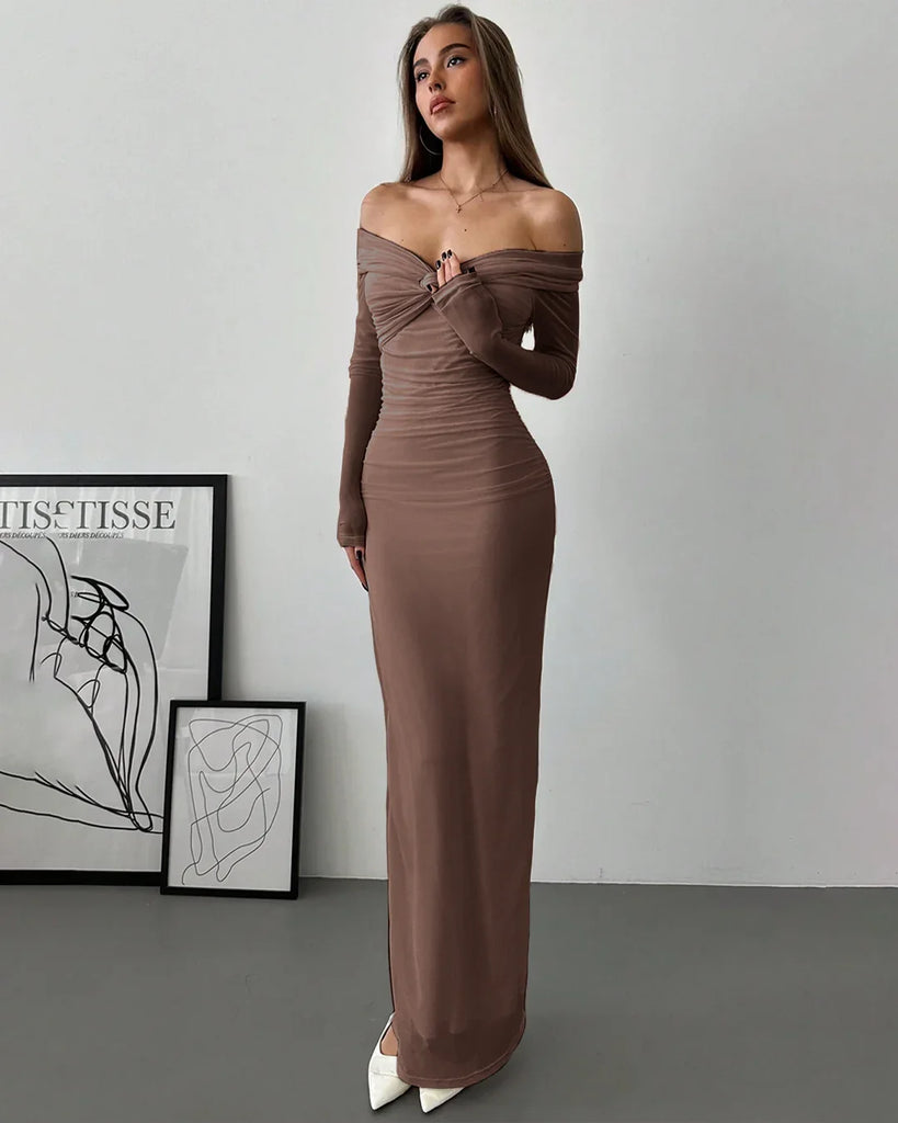 A model showcases a brown off-the-shoulder dress with long sleeves, featuring a ruched and fitted design.