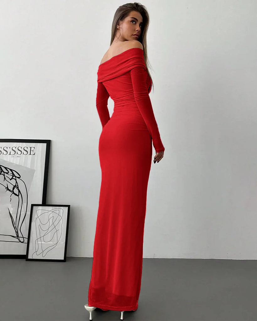 Back view of a woman in a dark red off-shoulder mesh ruched fitted dress with long sleeves.
