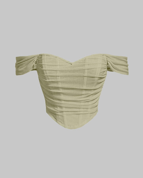 Off-shoulder green mesh top featuring a stylish ruched neckline