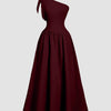 Burgundy one-shoulder midi dress featuring a bow at the neck and a fit-and-flare silhouette.