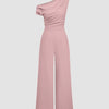 One-shoulder dusty pink jumpsuit with draped design and wide legs, showcasing a stylish and elegant silhouette.