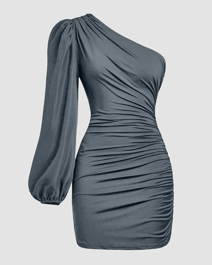 One-shoulder grey bodycon mini dress with ruched detailing and an asymmetrical hemline.
