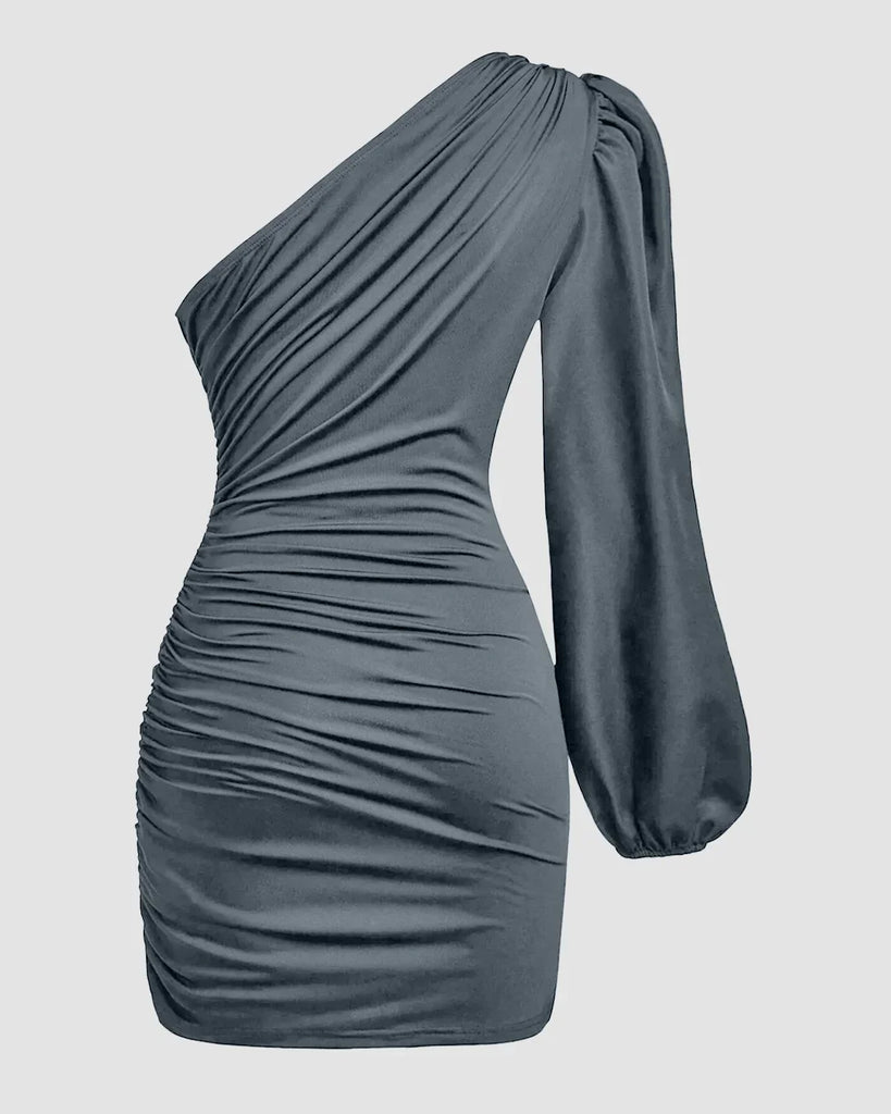 One-shoulder grey bodycon mini dress with ruched detailing and an asymmetrical hemline.
