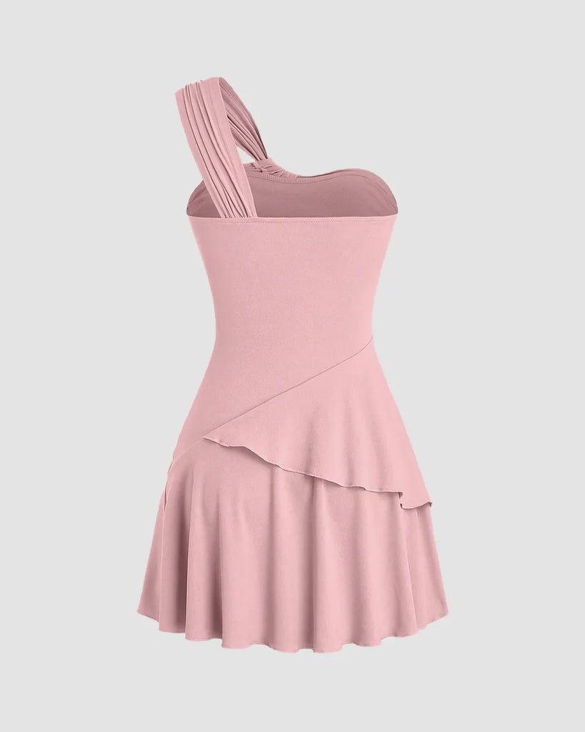 Dusty pink one-shoulder mini dress with ruched bodice and layered hem, perfect for a night out or special occasions.