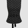 Front view of black polka dot top brings a playful twist with a clean, fitted silhouette.