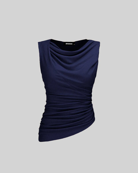 A Solid Ruched Round Neck Crop Top in Navy, featuring all-over ruching, a round neckline, and an asymmetric hem for a structured yet flattering fit.