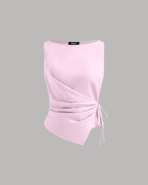Front view of Side tie top with wrap-style front, soft fabric and adjustable knot detail for a flattering and modern everyday look.