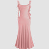 Pink midi dress featuring ruffled shoulder straps and a fishtail hem, elegantly designed for a stylish look.
