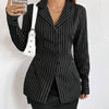 Front view of black full sleeve shirt with pinstripe pattern, tailored fit and button front design styled as a mini dress.