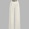 Front view of Off-white wide leg trousers with high waist, pleated front, belt detail, and smooth full length tailored silhouette.