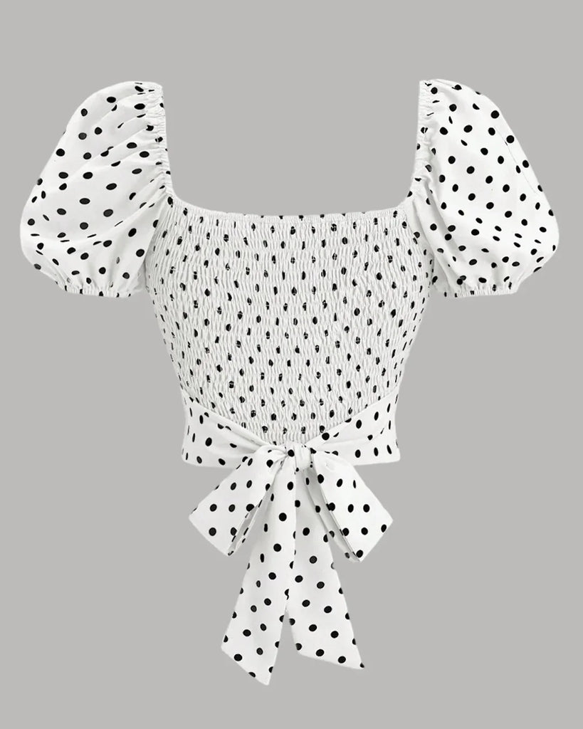 Back view of a White polka dot puff sleeve wrap top with a bow and ruffle detailing, perfect for a stylish casual look.
