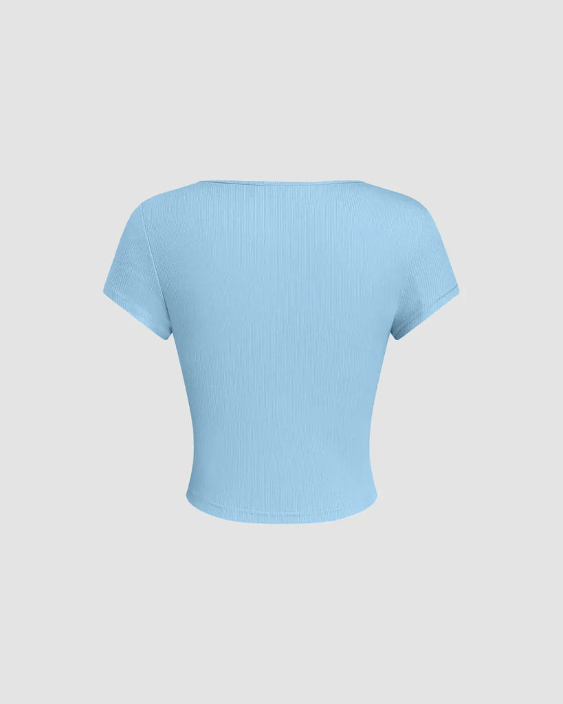 Back of Powder blue fitted top featuring a sheer lace neckline detail, showcasing a stylish and elegant design
