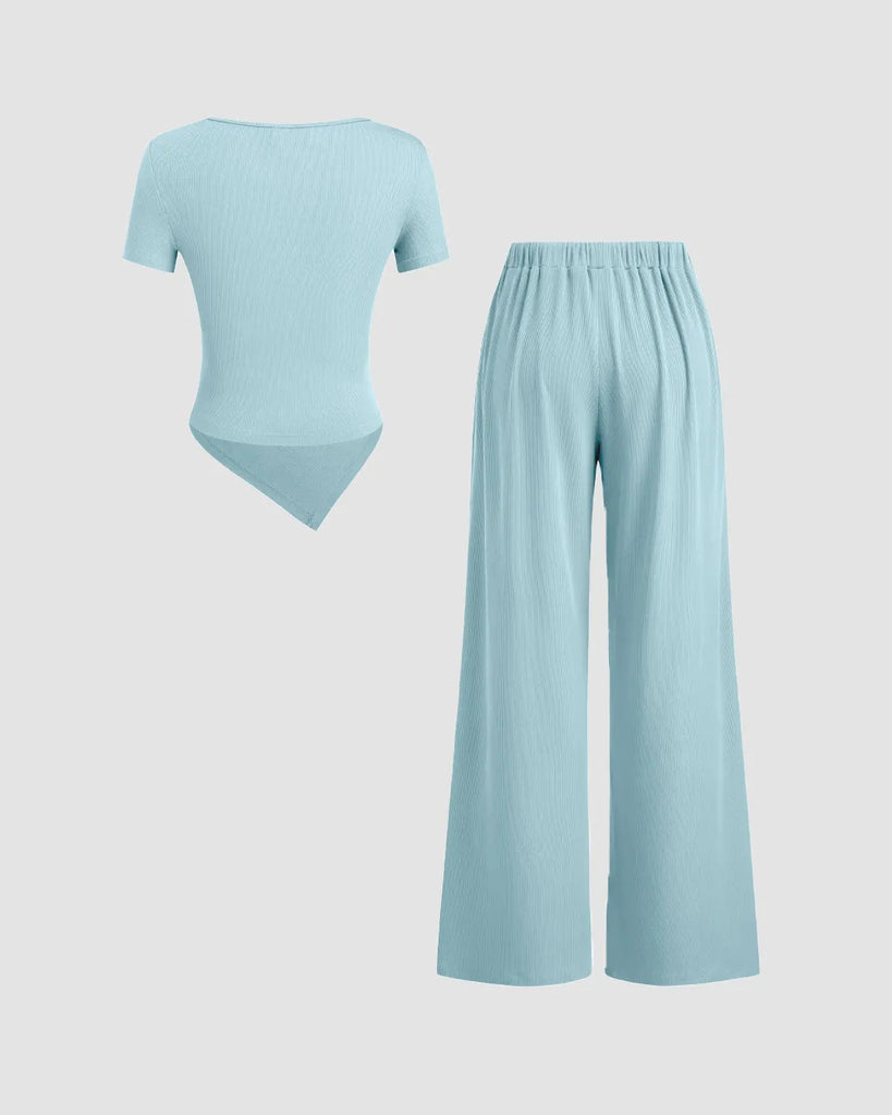 Back view of a Powder blue wrap v-neck top paired with wide leg pants in a stylish co-ord set for women.