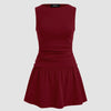 A maroon mini cami dress featuring a round neckline and a ruffled hem, showcasing a stylish and elegant design.
