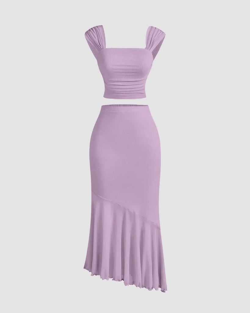 Soft, lightweight lilac dress featuring a ruched crop top and an asymmetric hem skirt set.