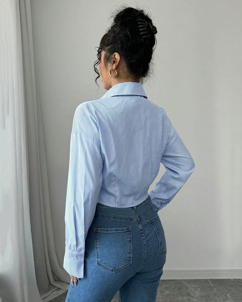 A person wearing collared crop stylish shirt with a ruched front, perfect for blending business and streetwear vibes