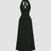 Ruched halter neck black midi dress featuring a gathered bust and flowy silhouette with a standout backless detail.