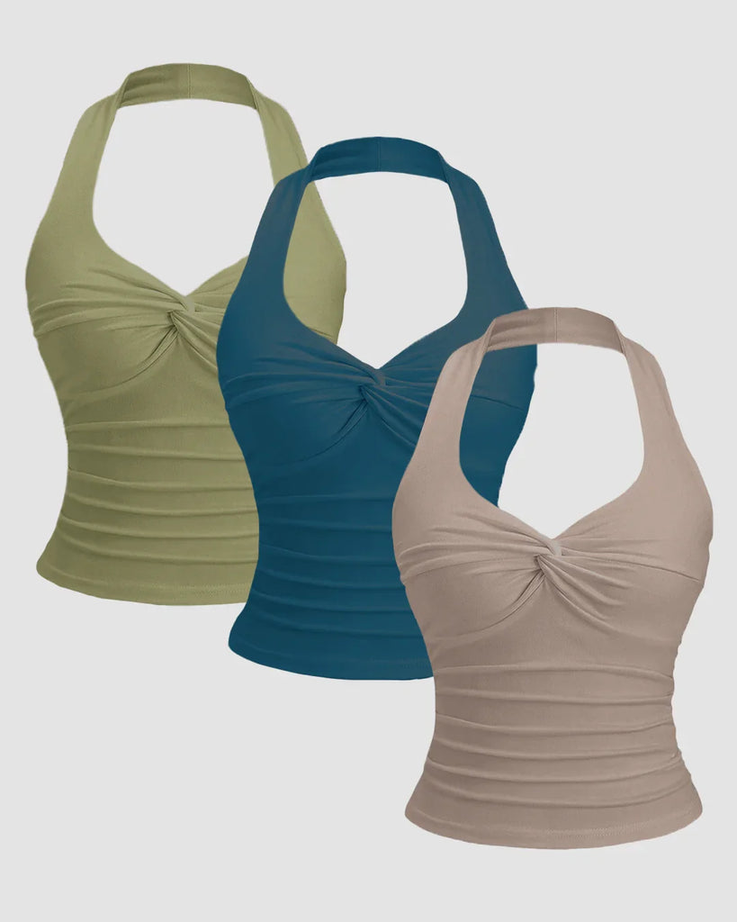 Three ruched halter neck tank tops in sage, beige, and teal blue displayed together.
