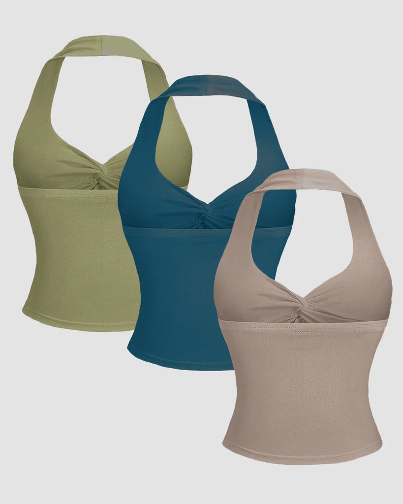 Back view of a Three ruched halter neck tank tops in sage, beige, and teal blue displayed together.