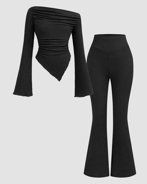 Front view of Black ruched long sleeve fitted knit top with flare pants two piece set, featuring a sleek coordinated silhouette