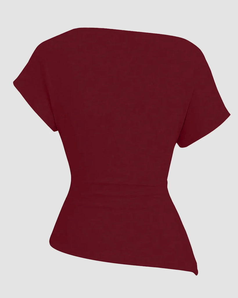 Back view of a Ruched one-shoulder asymmetric top in maroon with short sleeves, showcasing a stylish and modern design for women.