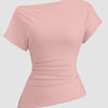 Pink ruched top with an asymmetric neckline, featuring one shoulder design in a rose color.