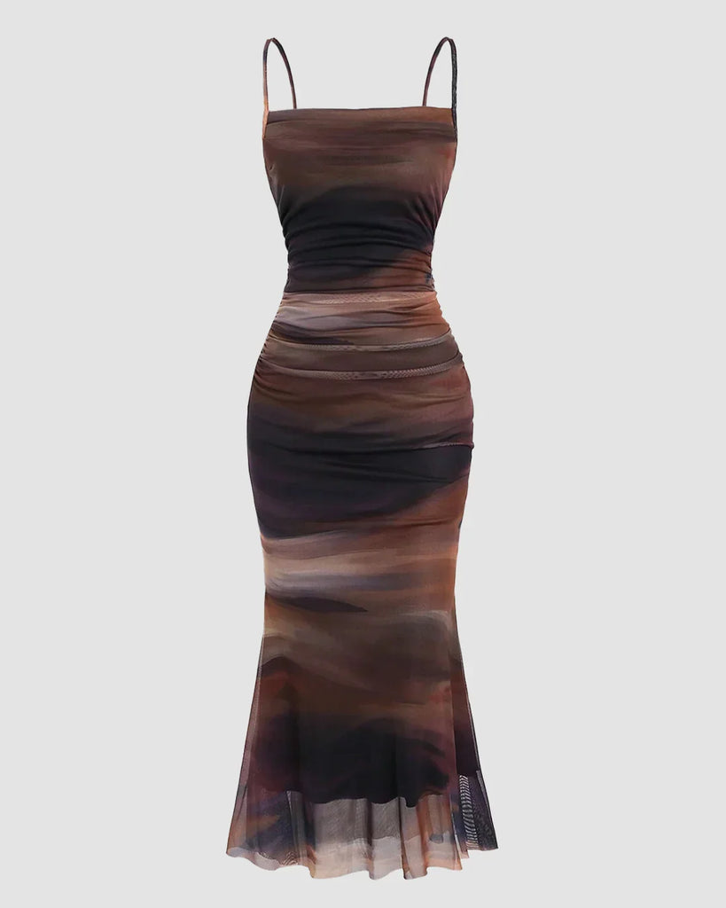 Ruched sheer mesh mermaid hem dress featuring a stylish brown and black print.
