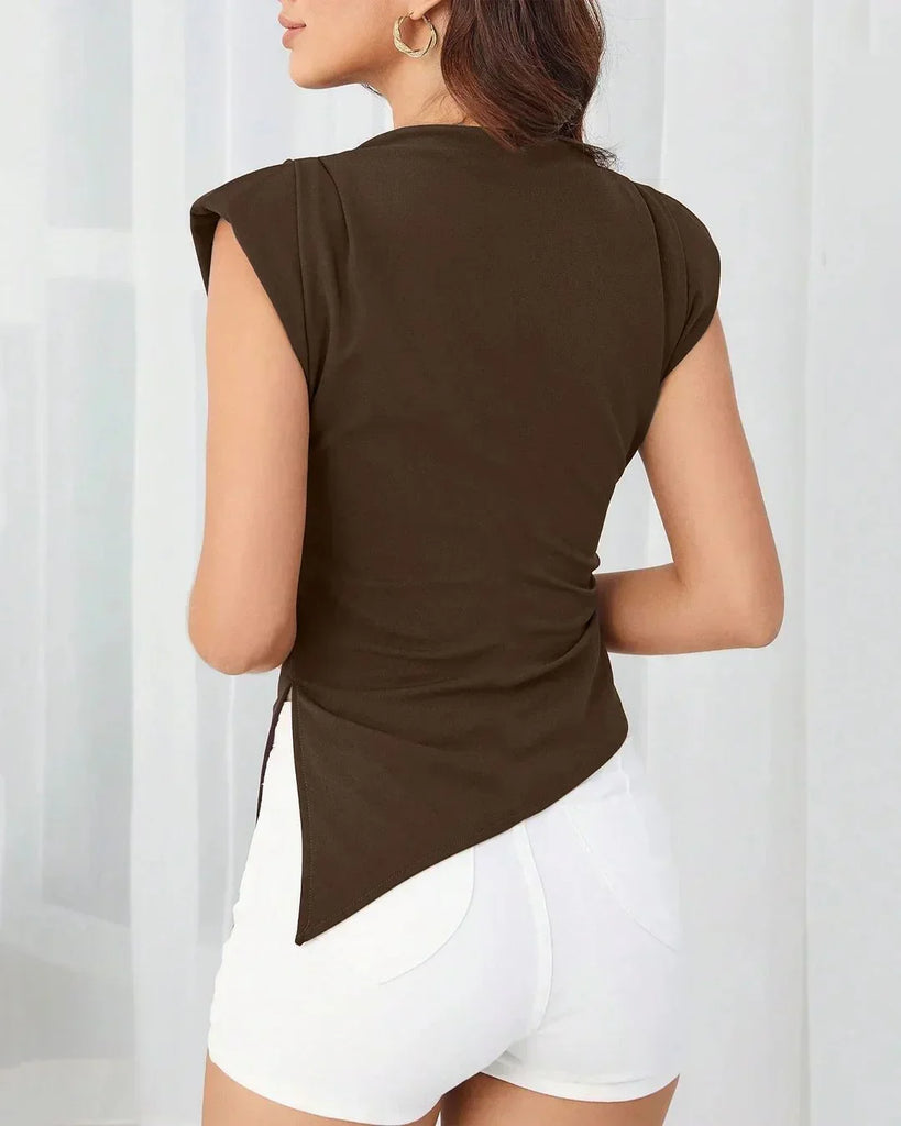 Back view of a Model showcases a brown ruched side cap sleeve top featuring a stylish side slit.