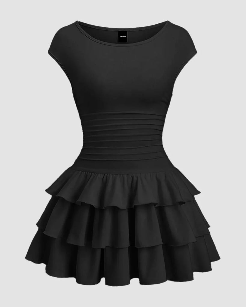 Black mini dress featuring a ruched waist and a tiered ruffle skirt, perfect for a stylish and elegant look.